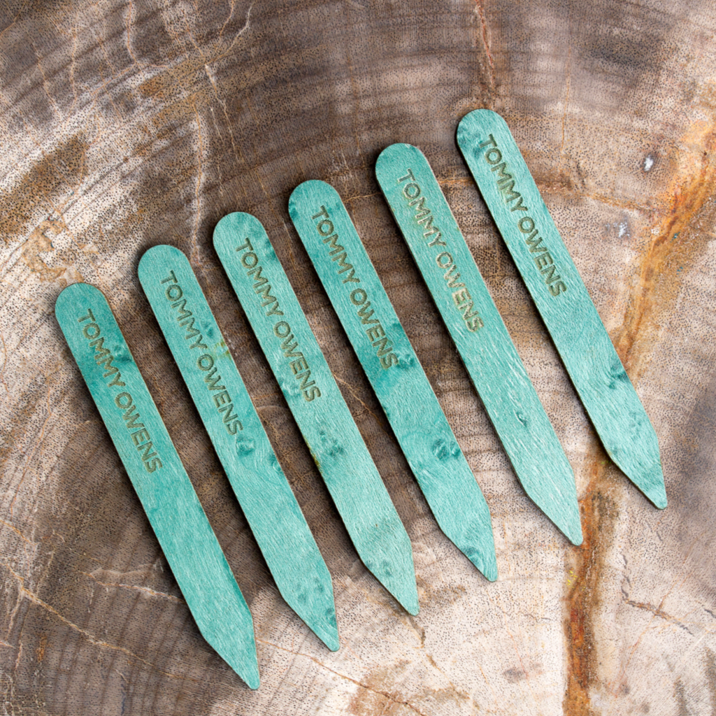 Rare and beautiful turquoise birdseye maple collar stays arranged in a row, showcasing their distinctive "birdseye" pattern and subtle turquoise hue.