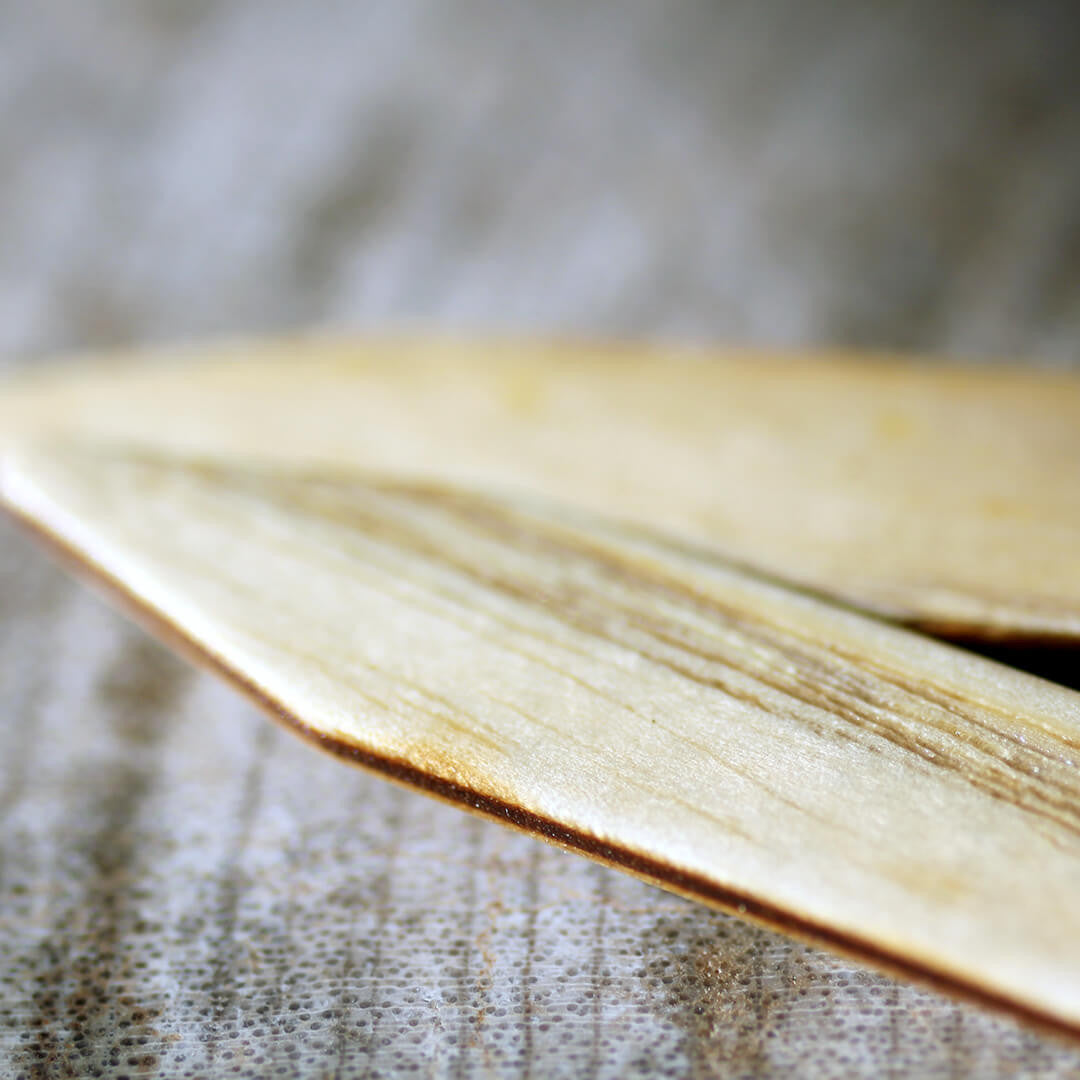 Ash wood collar stays casually scattered, highlighting their natural color and subtle grain.