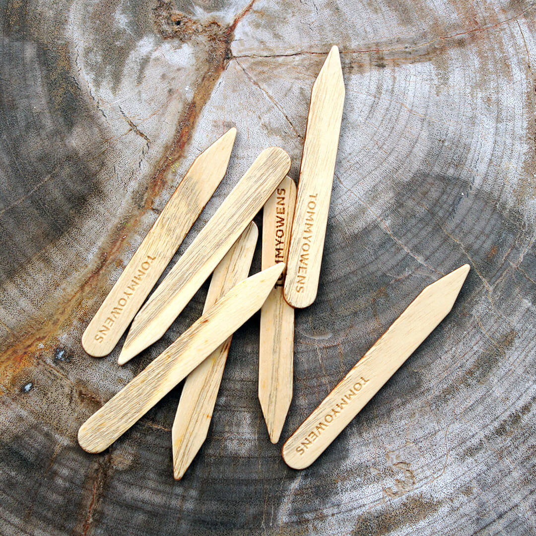 6 handcrafted ash wood collar stays, showcasing the light grain and smooth finish. Perfect for keeping shirt collars crisp and stylish.